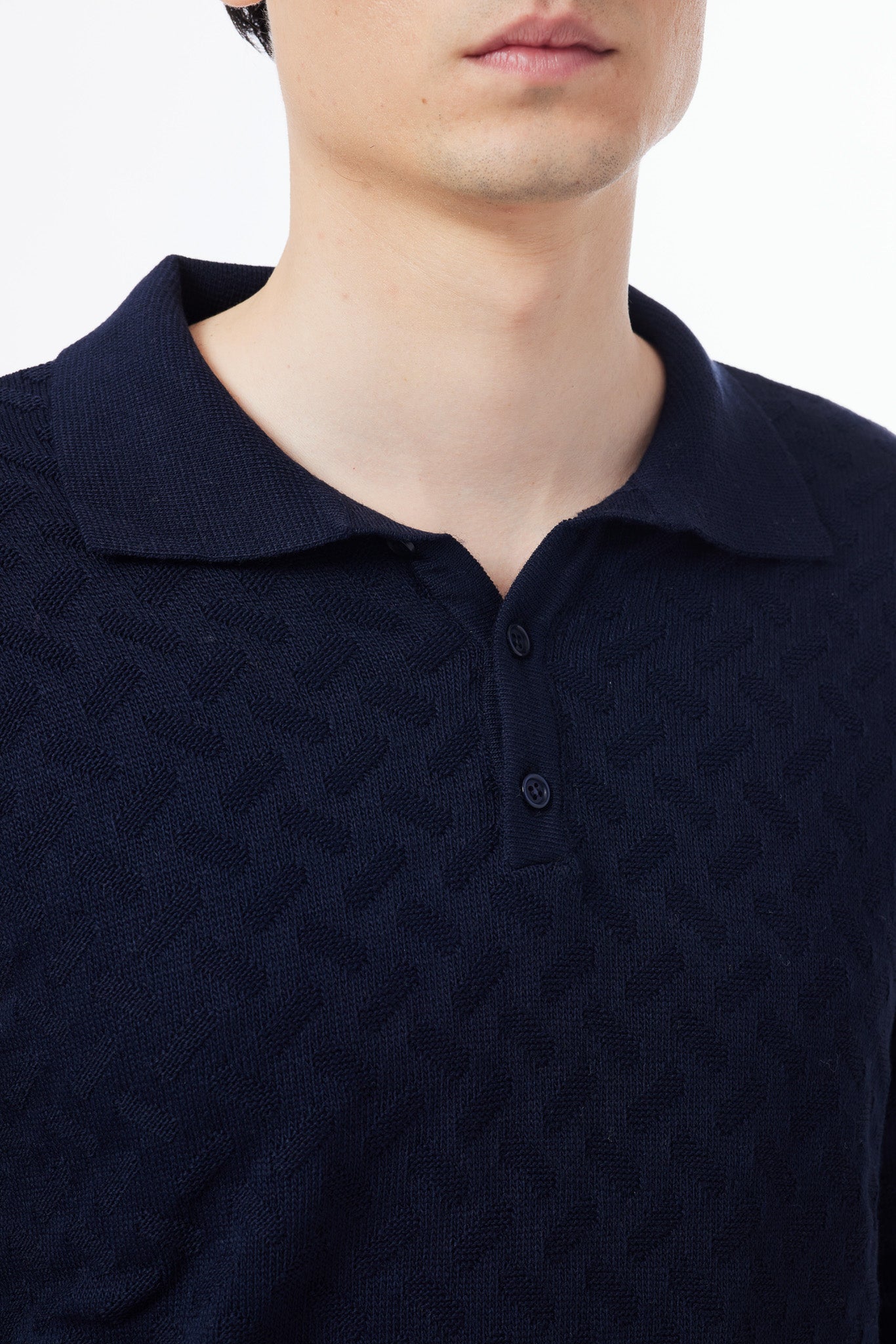 Polo a manica lunga in punto maglia operata